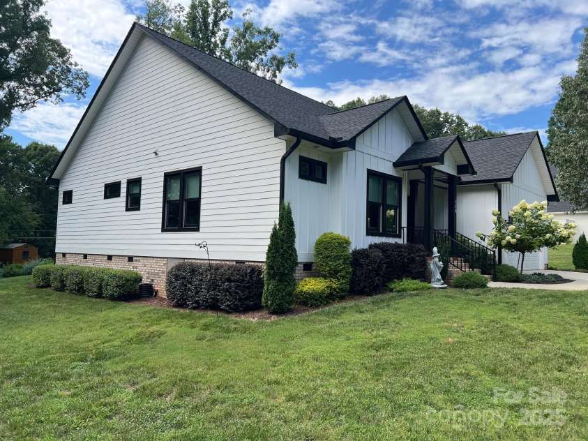 126 Redbud Lane, Troutman, NC 28166.  MLS# CAR4284135, YatesRealty ID 32890. Here are some photos of the exterior of this custom built home.