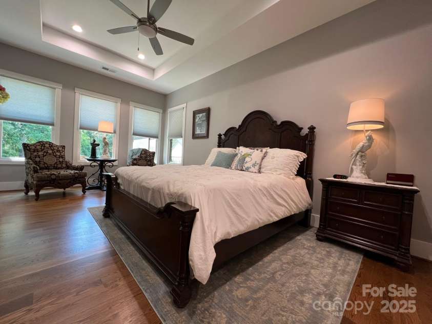 126 Redbud Lane, Troutman, NC 28166.  MLS# CAR4284135, YatesRealty ID 32890. On the back of the house, you will discover the owners' suite. The owners' bedroom is very large with room for a quiet sitting area by the windows.