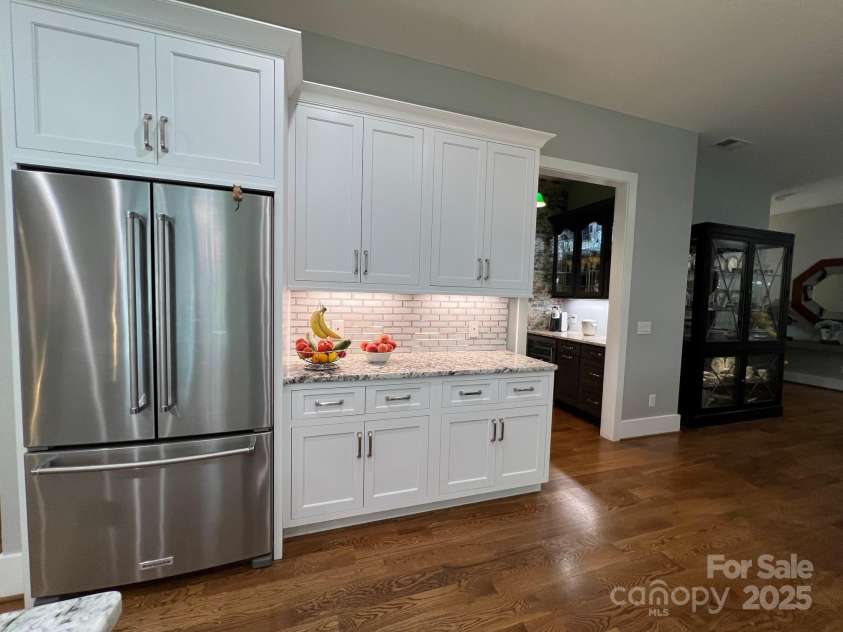 126 Redbud Lane, Troutman, NC 28166.  MLS# CAR4284135, YatesRealty ID 32890. The best nook in this lovely home is found inside that doorway next to the cabinets.