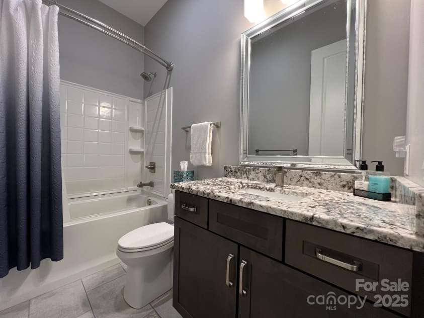 126 Redbud Lane, Troutman, NC 28166.  MLS# CAR4284135, YatesRealty ID 32890. This 2nd full bath is conveniently located near all the guest bedrooms and the office.