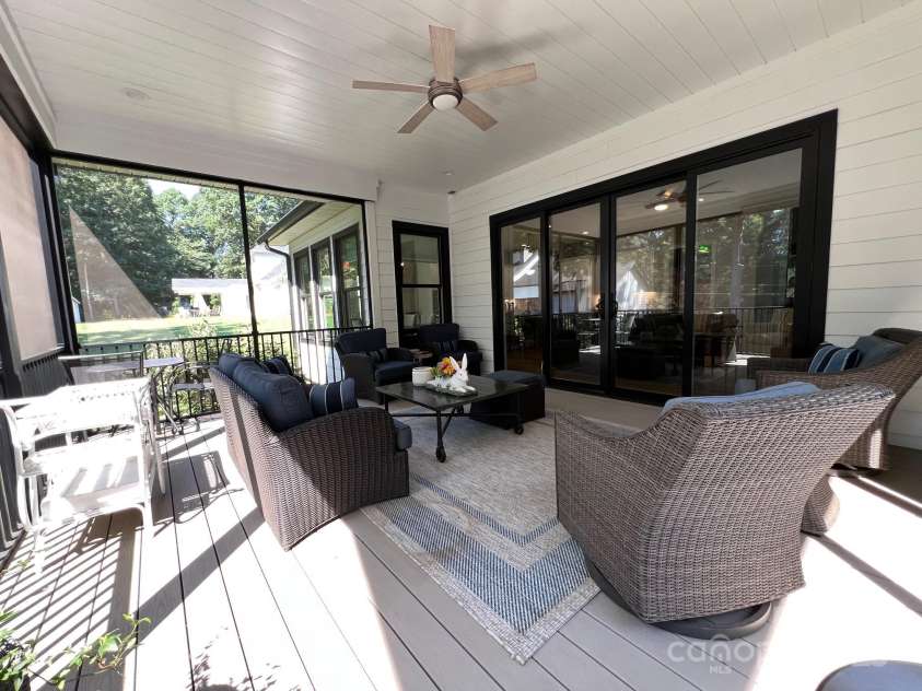 126 Redbud Lane, Troutman, NC 28166.  MLS# CAR4284135, YatesRealty ID 32890. This outdoor room is a great place to read a book, visit with friends or use it for your home office when the weather is nice.