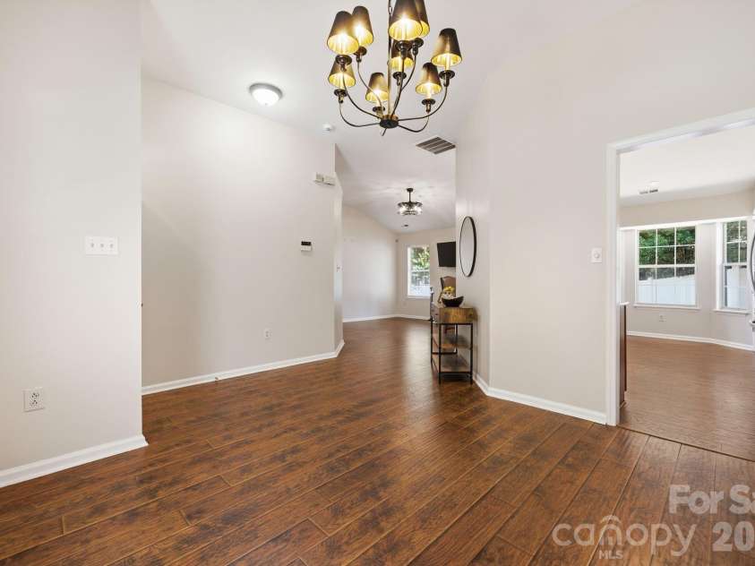 5701 Ebley Lane, Charlotte, NC 28227.  MLS# CAR4390398, YatesRealty ID 32891. Dinning Room looking into kitchen and living room