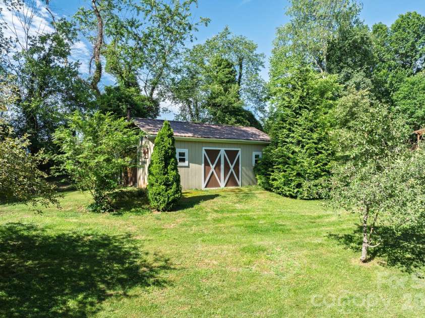 17 Squires Lane, Candler, NC 28715.  MLS# CAR4372745, YatesRealty ID 32899. Additional space with this storage shed or workshop (hobby) space in the yard