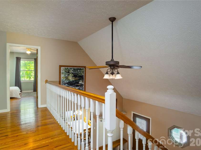 17 Squires Lane, Candler, NC 28715.  MLS# CAR4372745, YatesRealty ID 32899. Open loft area overlooking foyer
