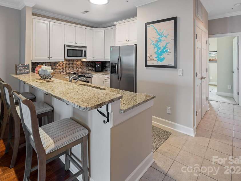 18726 Nautical Drive, Cornelius, NC 28031.  MLS# CAR4171008, YatesRealty ID 3290. BREAKFAST BAR  FOR 4 OR MORE