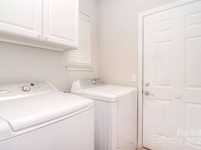1008 Magpie Court, Fort Mill, SC 29707.  MLS# CAR4292540, YatesRealty ID 32913. Laundry room with extra cabinets