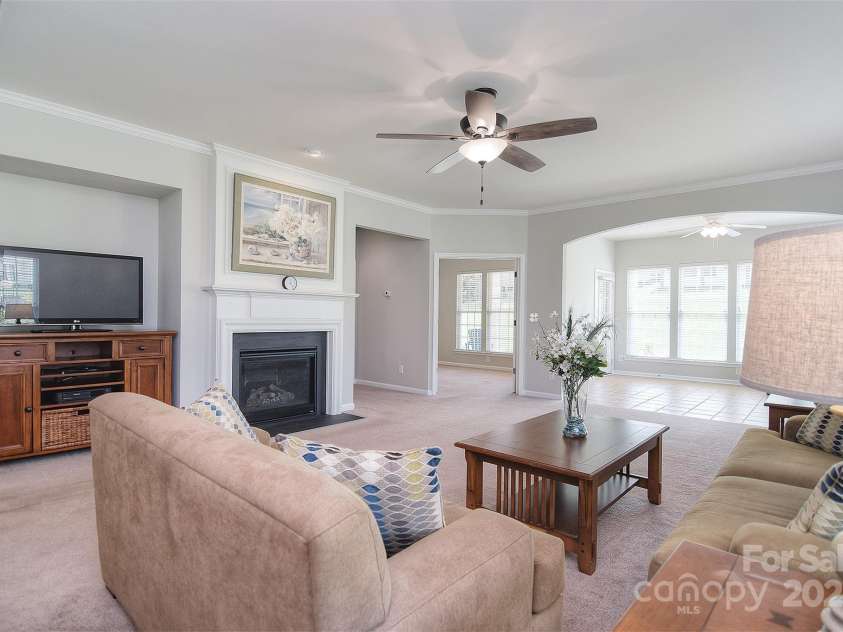 1008 Magpie Court, Fort Mill, SC 29707.  MLS# CAR4292540, YatesRealty ID 32913. Living room looking into sunroom