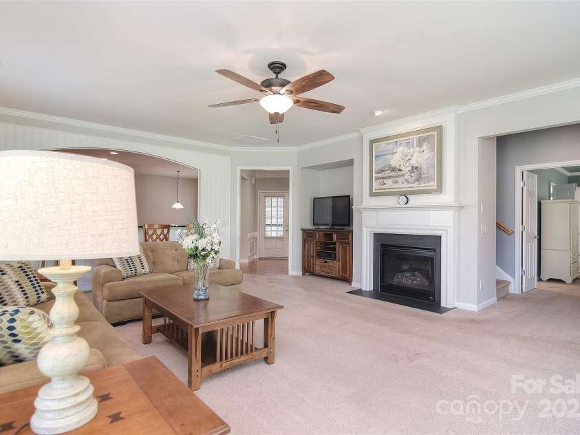 1008 Magpie Court, Fort Mill, SC 29707.  MLS# CAR4292540, YatesRealty ID 32913. Living room looking towards kitchen. Master bedroom on the right