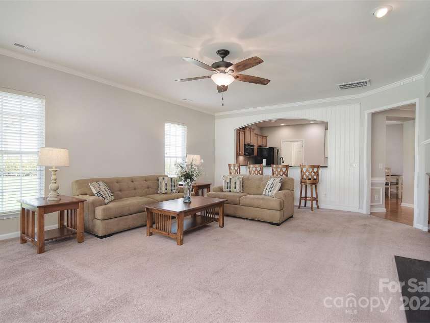 1008 Magpie Court, Fort Mill, SC 29707.  MLS# CAR4292540, YatesRealty ID 32913. Looking at living room from sunroom