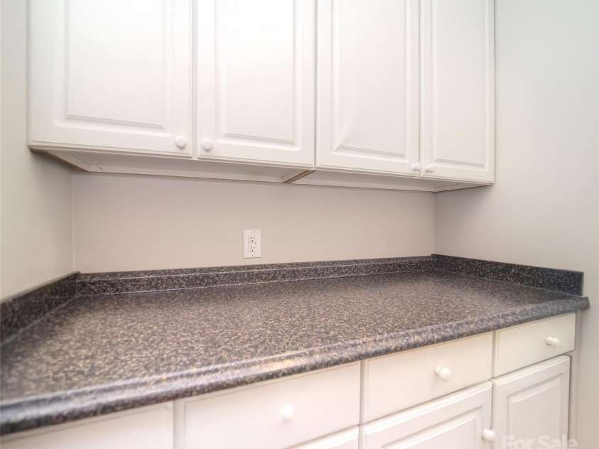 1008 Magpie Court, Fort Mill, SC 29707.  MLS# CAR4292540, YatesRealty ID 32913. More cabinets in laundry room