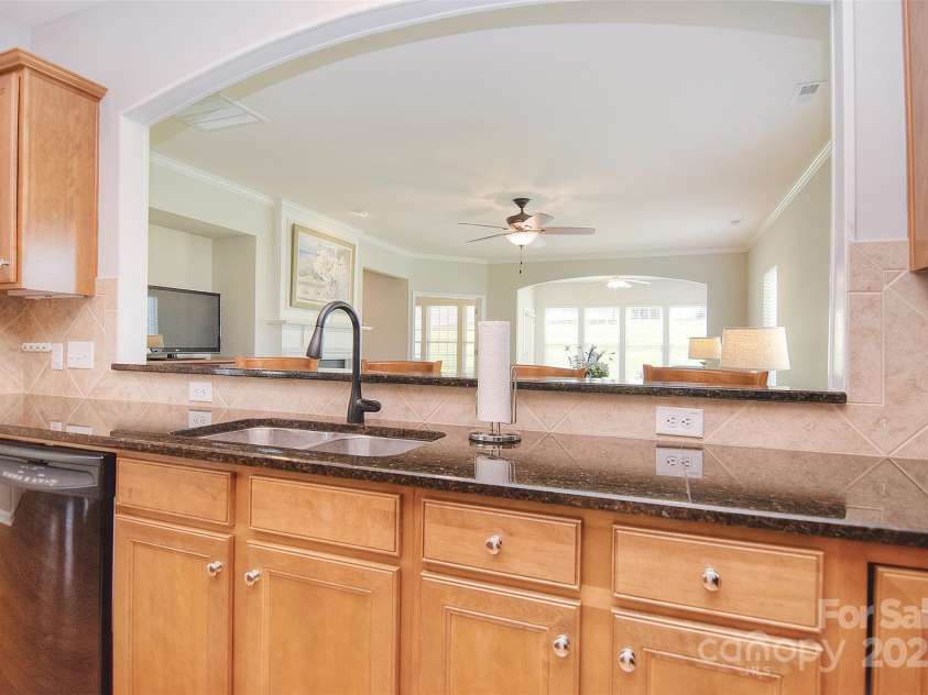 1008 Magpie Court, Fort Mill, SC 29707.  MLS# CAR4292540, YatesRealty ID 32913. View from kitchen to living room