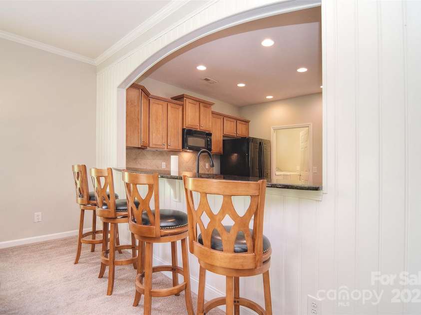 1008 Magpie Court, Fort Mill, SC 29707.  MLS# CAR4292540, YatesRealty ID 32913. View from living room to kitchen