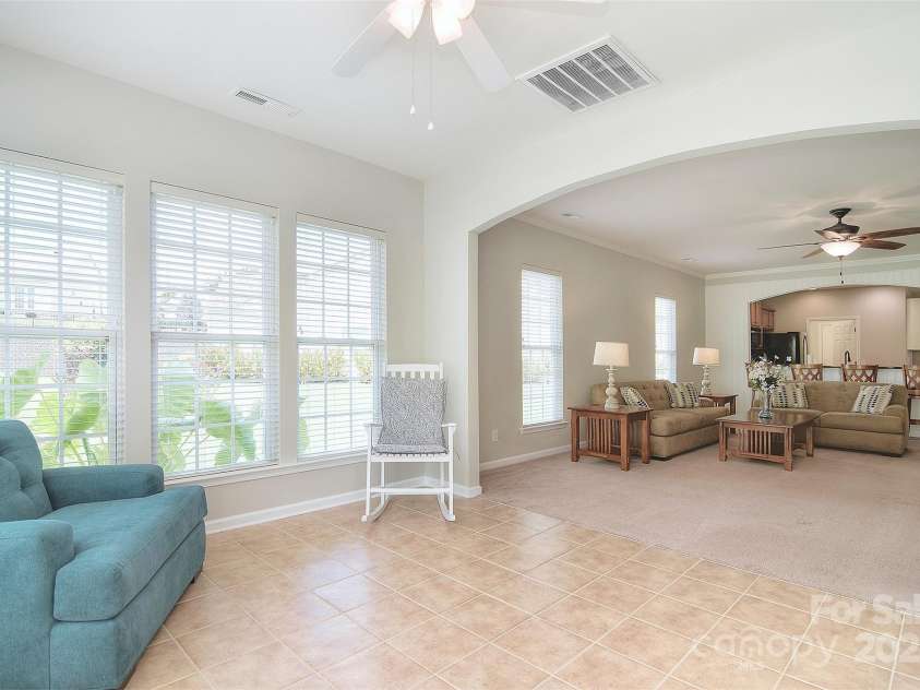 1008 Magpie Court, Indian Land, SC 29707.  MLS# CAR4292540, YatesRealty ID 32913. Looking at living room from sunroom