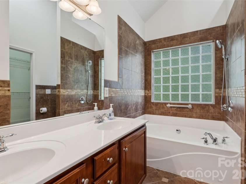 3078 Richards Way Drive, Rock Hill, SC 29732.  MLS# CAR4394528, YatesRealty ID 32922. En-suite bathroom offers dual sinks, large soaking tub and tile for days!