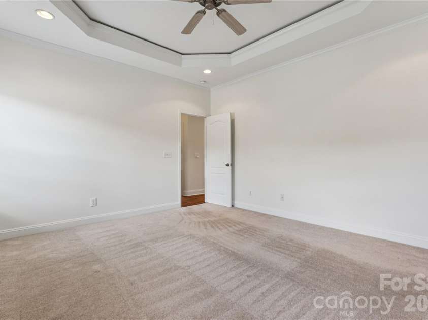 3078 Richards Way Drive, Rock Hill, SC 29732.  MLS# CAR4394528, YatesRealty ID 32922. Generous primary suite features gorgeous tray ceiling, recessed lighting, and fan