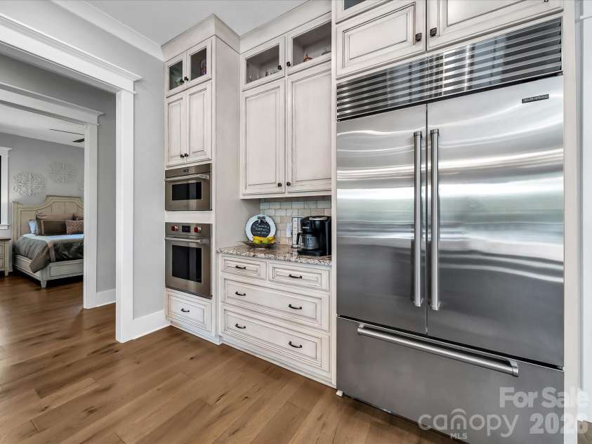 1579 Sunset Pointe Drive, Salisbury, NC 28146.  MLS# CAR4386995, YatesRealty ID 32928. Kitchen with Wolf wall oven, conventional oven/microwave and Sub-Zero Refrigerator