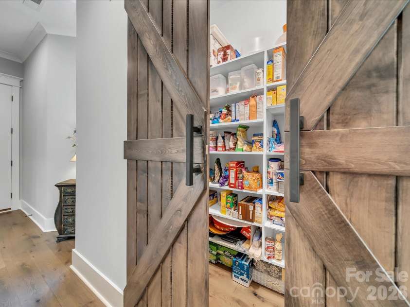 1579 Sunset Pointe Drive, Salisbury, NC 28146.  MLS# CAR4386995, YatesRealty ID 32928. Pantry with Barn Doors and Custom Shelving