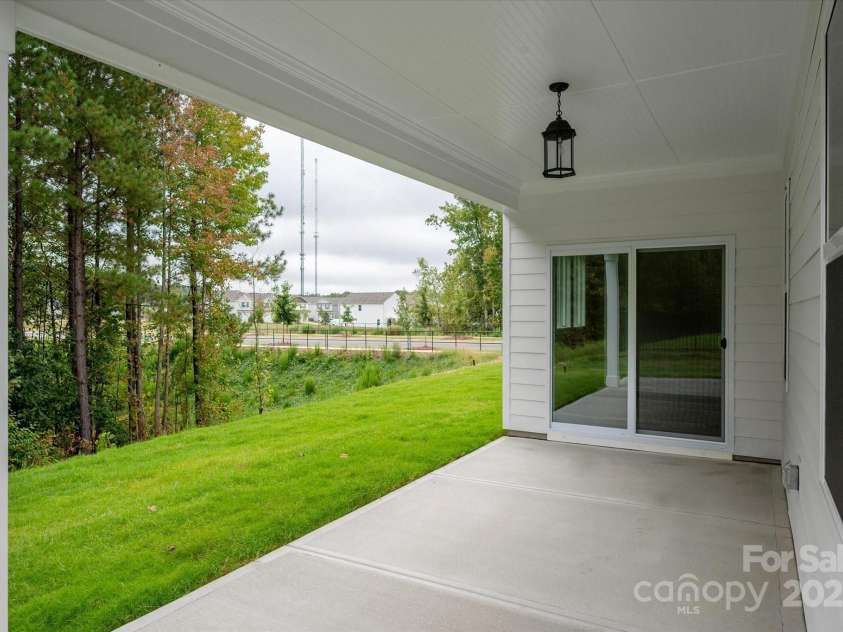 7926 Rolling Wheels Road, Charlotte, NC 28215.  MLS# CAR4289373, YatesRealty ID 3293. Rear Covered Patio