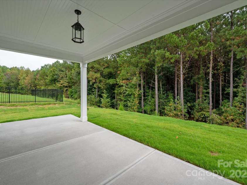 7926 Rolling Wheels Road, Charlotte, NC 28215.  MLS# CAR4289373, YatesRealty ID 3293. Rear Covered Patio