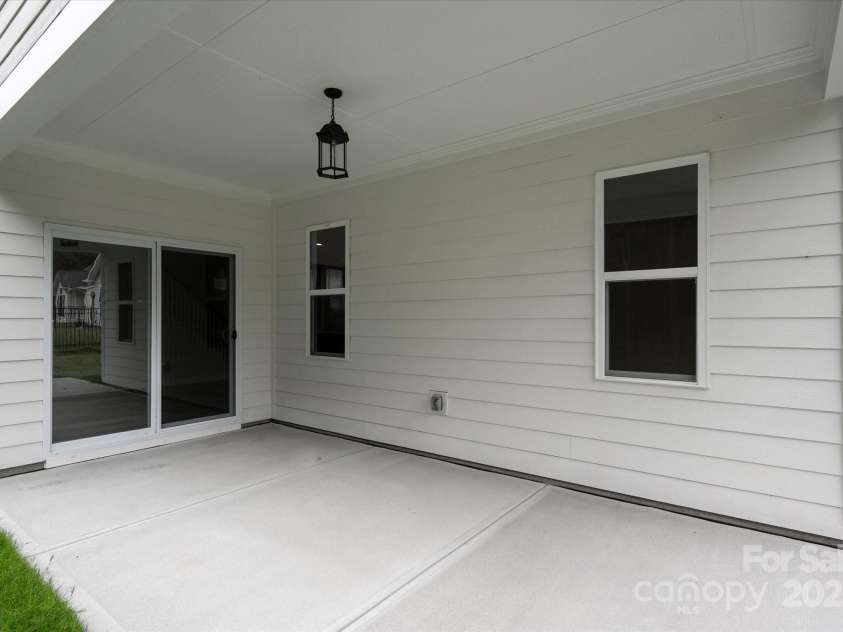7926 Rolling Wheels Road, Charlotte, NC 28215.  MLS# CAR4289373, YatesRealty ID 3293. Rear Covered Patio