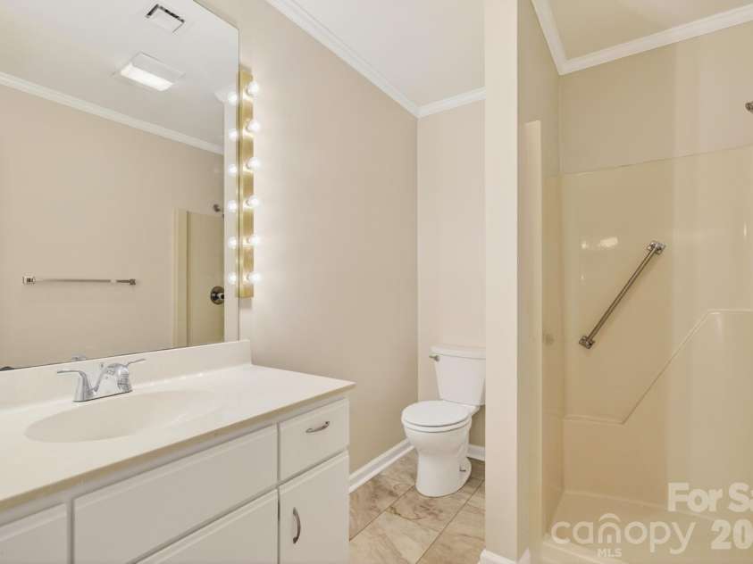 10 Laurel Place Drive, Asheville, NC 28803.  MLS# CAR4370539, YatesRealty ID 32935. Guest bathroom with shower