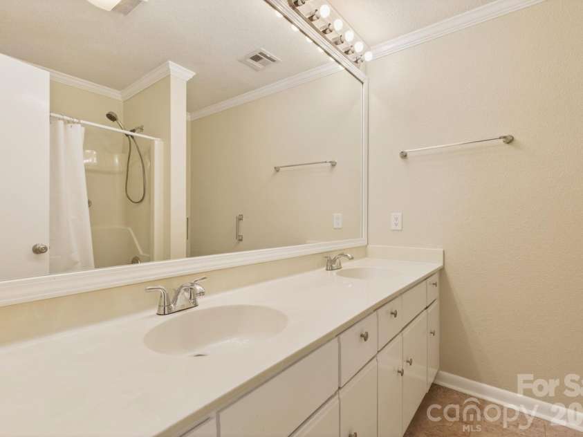 10 Laurel Place Drive, Asheville, NC 28803.  MLS# CAR4370539, YatesRealty ID 32935. Primary bathroom with double vanity