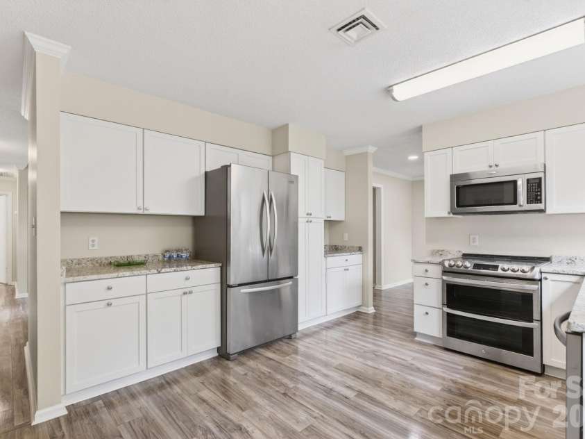 10 Laurel Place Drive, Asheville, NC 28803.  MLS# CAR4370539, YatesRealty ID 32935. Refrigerator side of the kitchen
