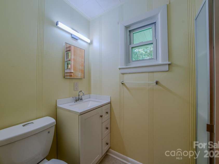 105 Alexander Avenue, Swannanoa, NC 28778.  MLS# CAR4289989, YatesRealty ID 32936. Half Bathroom by Kitchen