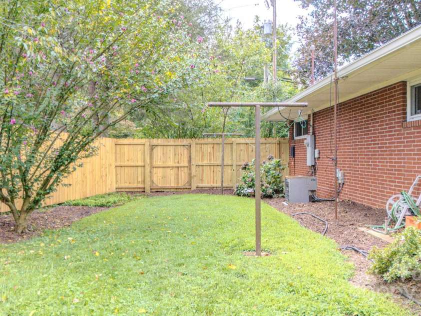 105 Alexander Avenue, Swannanoa, NC 28778.  MLS# CAR4289989, YatesRealty ID 32936. Side yard