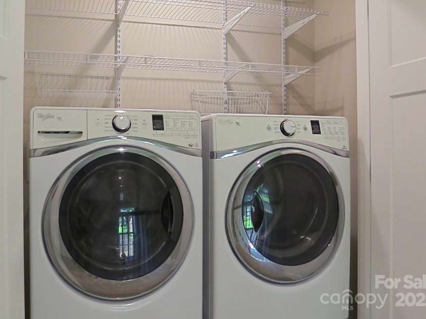 219 Fayetteville Street, Asheville, NC 28806.  MLS# CAR4291036, YatesRealty ID 32938. Laundry closet with shelving, the washer and dryer convey.