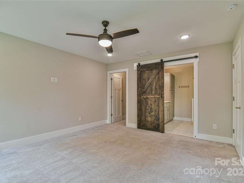 219 Fayetteville Street, Asheville, NC 28806.  MLS# CAR4291036, YatesRealty ID 32938. Primary Suite with ceiling fan on second level.