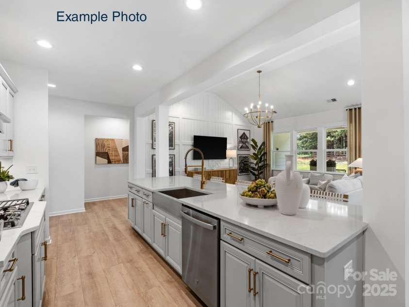 115 Tonbridge Way, Mooresville, NC 28115.  MLS# CAR4305877, YatesRealty ID 3294. Example Photo - Kitchen/Family Room *Kitchen shows optional split cooking upgrade