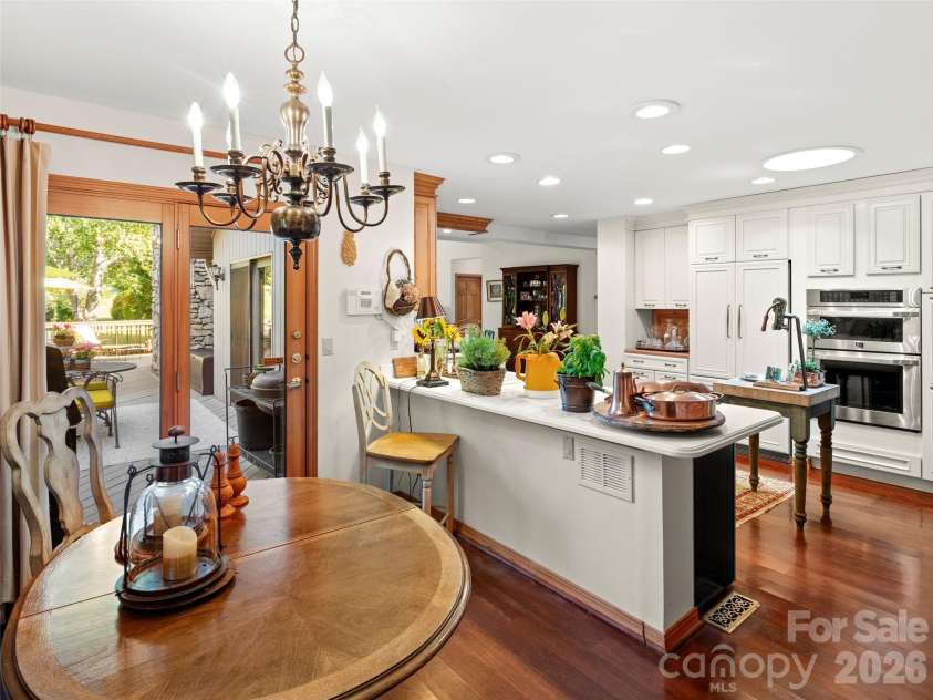 20 Clubside Drive, Asheville, NC 28804.  MLS# CAR4393618, YatesRealty ID 32941. Breakfast area, open kitchen and deck access