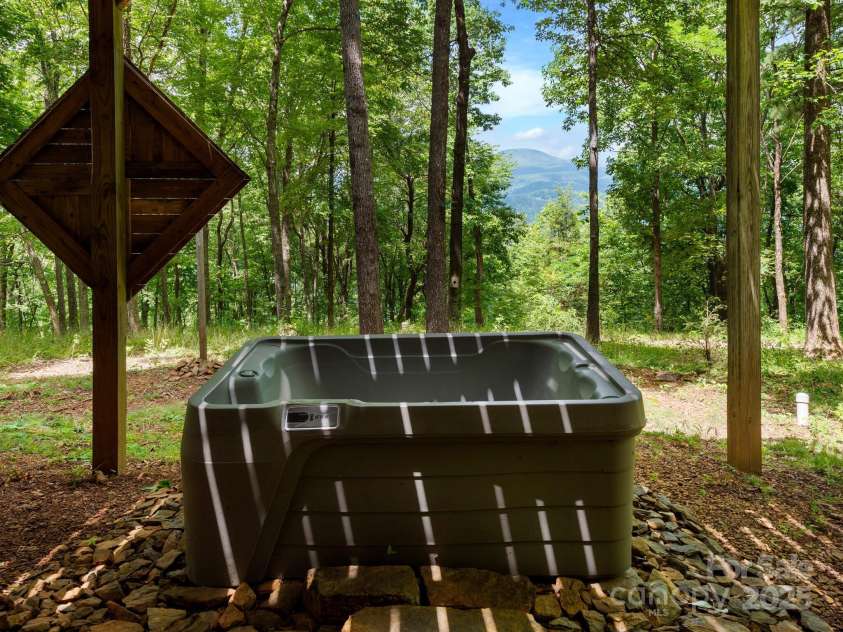 2838 Little Creek Road, Hendersonville, NC 28792.  MLS# CAR4282248, YatesRealty ID 32945. Enjoy a dip in the hot tub under the stars.