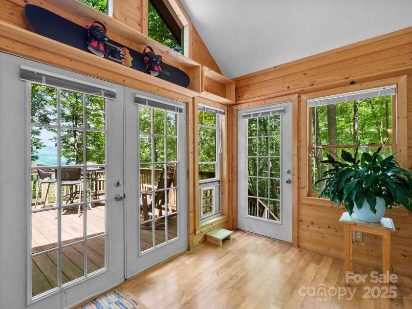 2838 Little Creek Road, Hendersonville, NC 28792.  MLS# CAR4282248, YatesRealty ID 32945. Indoor comfort with outdoor ambiance on the sunporch.