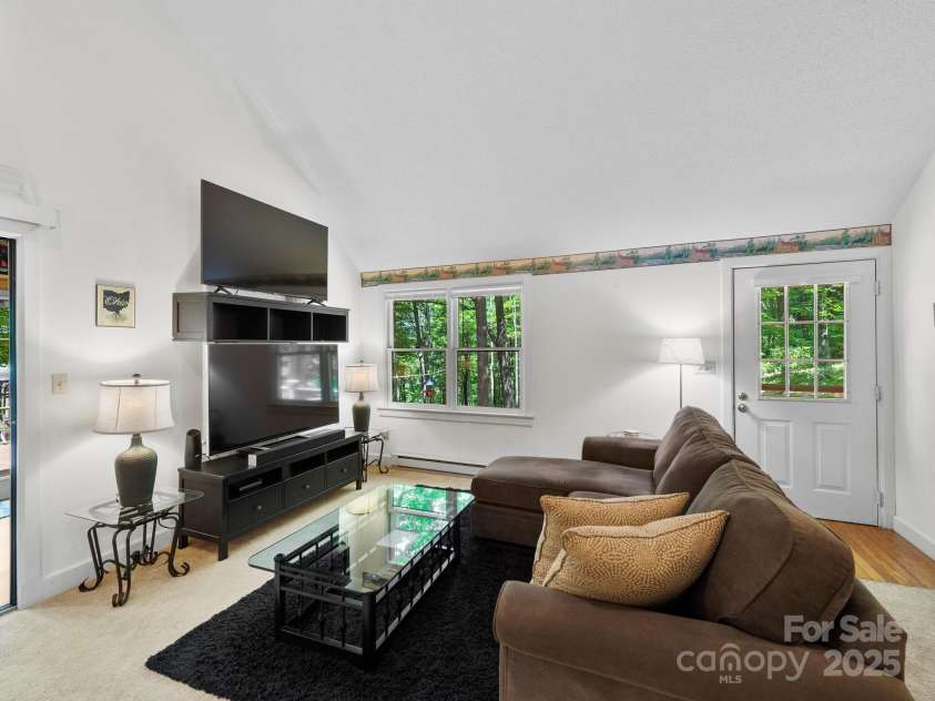 2838 Little Creek Road, Hendersonville, NC 28792.  MLS# CAR4282248, YatesRealty ID 32945. Living room view taken from the kitchen island.