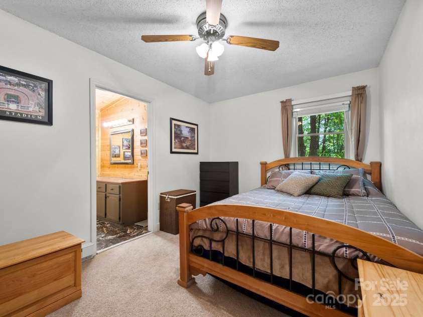 2838 Little Creek Road, Hendersonville, NC 28792.  MLS# CAR4282248, YatesRealty ID 32945. Main level primary bedroom