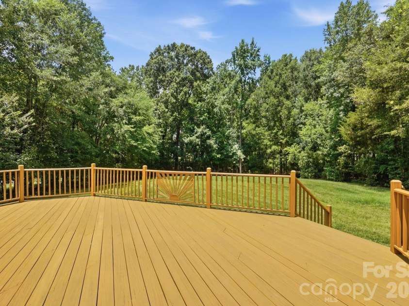 3818 Mourning Dove Drive, Weddington, NC 28104.  MLS# CAR4392796, YatesRealty ID 32948. 2017 rebuilt deck overlooks huge private yard.