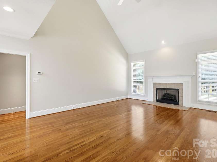 3818 Mourning Dove Drive, Weddington, NC 28104.  MLS# CAR4392796, YatesRealty ID 32948. Large great room with fireplace.