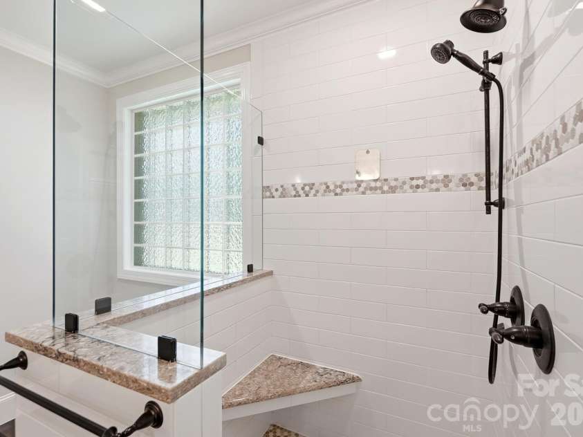 3818 Mourning Dove Drive, Weddington, NC 28104.  MLS# CAR4392796, YatesRealty ID 32948. Large walk in shower.