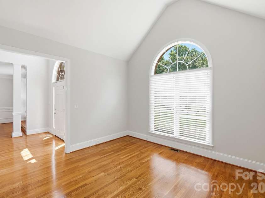 3818 Mourning Dove Drive, Weddington, NC 28104.  MLS# CAR4392796, YatesRealty ID 32948. Living room/den with vaulted ceiling.