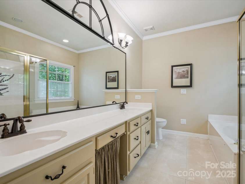 423 Shrewsbury Lane, Matthews, NC 28105.  MLS# CAR4283550, YatesRealty ID 32948. Primary Bath with dual sinks