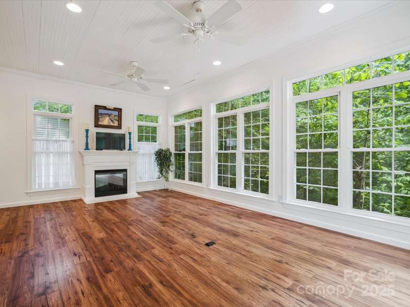 423 Shrewsbury Lane, Matthews, NC 28105.  MLS# CAR4283550, YatesRealty ID 32948. Sunroom/Primary on Main with electric fireplace