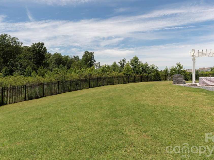 301 Contentment Drive, Locust, NC 28097.  MLS# CAR4395337, YatesRealty ID 32957. Backyard