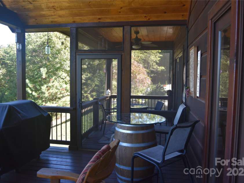 80 Grandview Loop, Nebo, NC 28761.  MLS# CAR4317495, YatesRealty ID 3296. Deck looking at one of the two screened areas on each side.