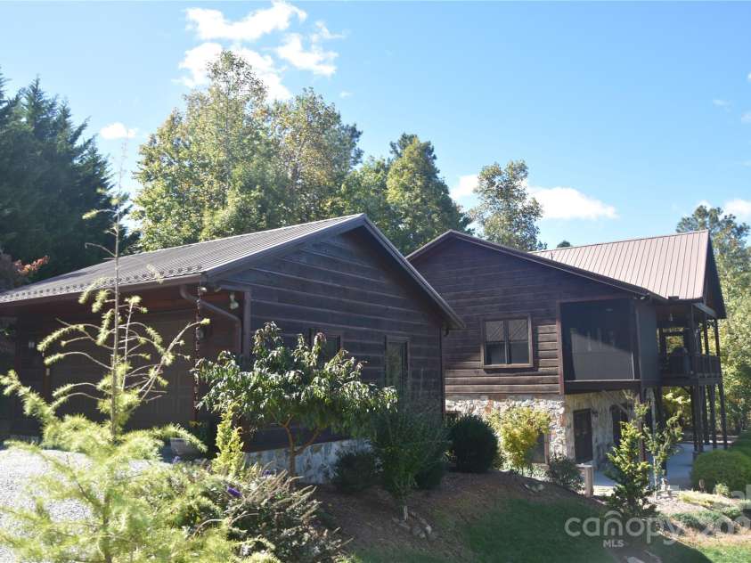 80 Grandview Loop, Nebo, NC 28761.  MLS# CAR4317495, YatesRealty ID 3296. View of the detached garage and home from the driveway.