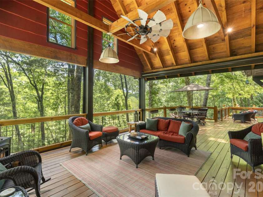 85 & 95 Ralph Thomas Road, Highlands, NC 28741.  MLS# CAR4395002, YatesRealty ID 32961. 95 Ralph Thomas Rd - Back Covered Deck with Electric Roll Down Plastic Curtains for Year-Round Use