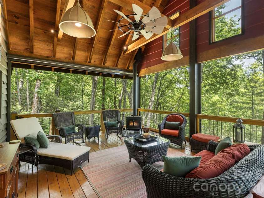 85 & 95 Ralph Thomas Road, Highlands, NC 28741.  MLS# CAR4395002, YatesRealty ID 32961. 95 Ralph Thomas Rd - Back Covered Deck with Electric Roll Down Plastic Curtains for Year Round Use