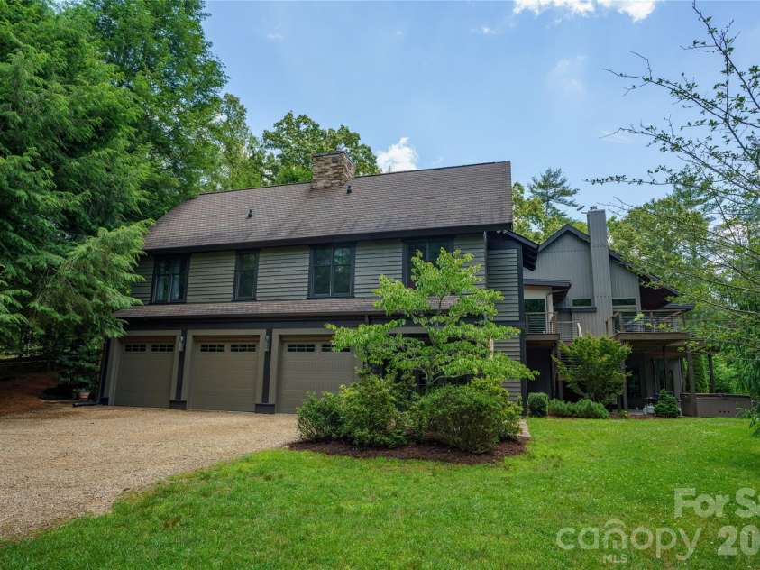 257 Bear Landing Drive, Hendersonville, NC 28792.  MLS# CAR4388350, YatesRealty ID 32963. An oversized three-car garage provides ample space for vehicles, storage, and recreational equipment.