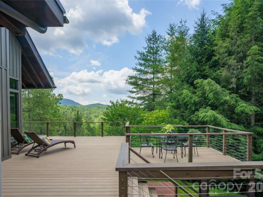 257 Bear Landing Drive, Hendersonville, NC 28792.  MLS# CAR4388350, YatesRealty ID 32963. Newly installed Deckorators Voyage decking with cable railing (2025).